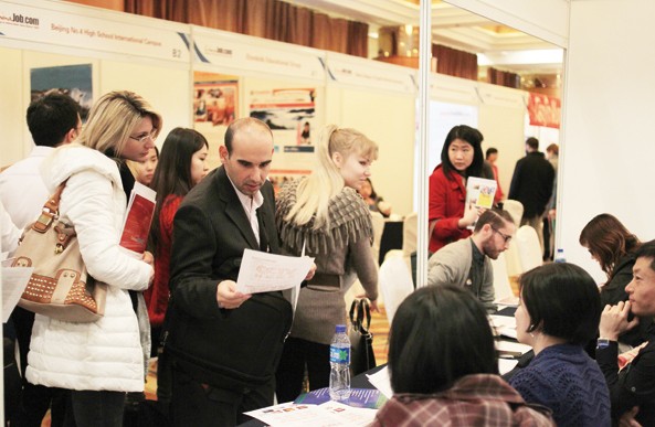 The Job Fair for Foreigners was held in Beijing on Nov 16. Official statistics show there are about 550,000 foreigners working in China. [Wang Jing / China Daily]  