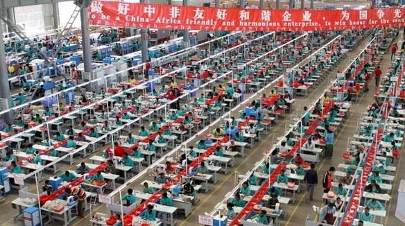 Staff members work at Huajian Group's Ethiopian plant. [Photo / Provided to China Daily]