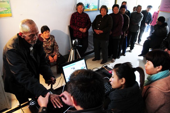 Biological information is collected from retirees, all older than 60 years, in Linyi, Shandong province in November. The information will be used in the future to confirm their identities more quickly. Fang Dehua / for China Daily  