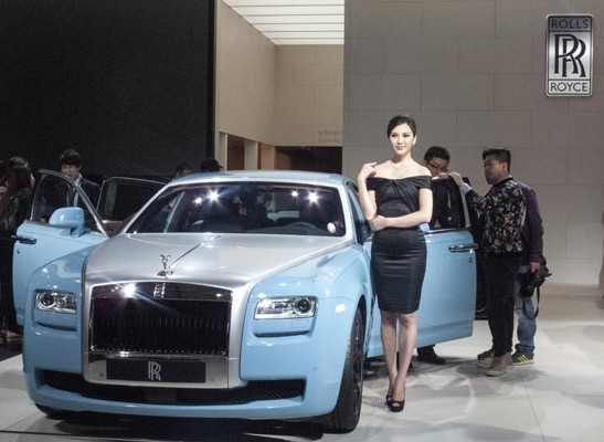 A new Rolls-Royce Ghost is displayed at a recent international auto exhibition in Shanghai. Strong year-on-year sales growth of 11 percent in 2013 gave China the lead over a distant-second United States. Provided to China Daily