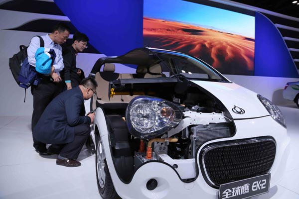 The EK-2 electric car, which was developed by the Zhejiang-based Geely Group, is shown at an auto show in Beijing. Sales of electric and hybrid vehicles are expected to reach 60,000 to 80,000 units this year in China.  Chen Ming / For China Daily