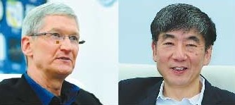 Apple Inc CEO Tim Cook (left) and Xi Guohua, China Mobile Ltd chairman, meet reporters in Beijing on Wednesday.   