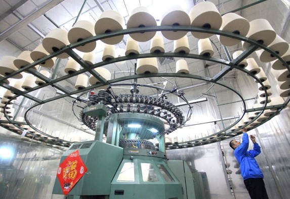 A textile mill in Jimo, Shandong province. The country's machinery industry has excess capacity, which is leading to the slower growth of profits in the sector. Liang Xiaopeng / For China Daily   