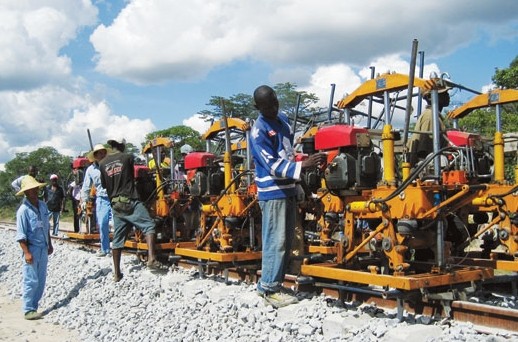 China Hyway Group Ltd's staff members work at a construction site in Africa. The company has businesses covering several industries in Mozambique, Angola, Guinea and South Sudan. Provided to China Daily   
