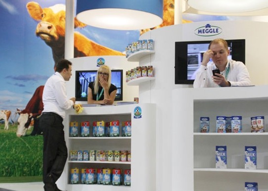 A Dutch dairy company's booth at an international exhibition in Beijing. China imported 1.52 million tons of dairy products from January to November 2013,up 35.7 percent. WU CHANGQING/CHINA DAILY  