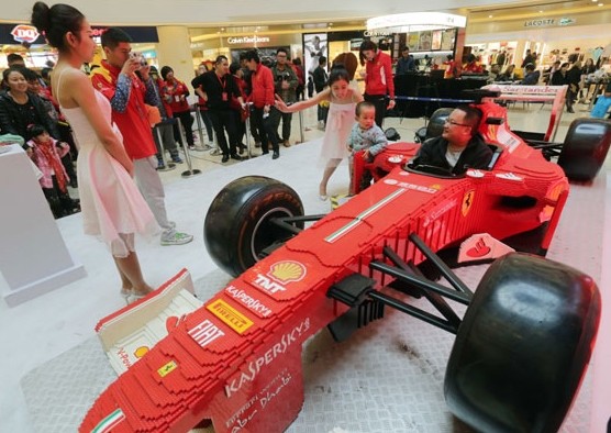 A racing car model built from Lego interlocking plastic bricks in a shopping mall in Weifang, Shandong province. ZHANG CHI/CHINA DAILY  