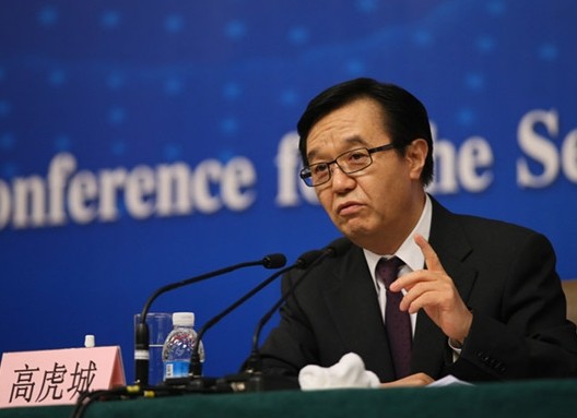 Commence Minister Gao Hucheng speaks when meeting the press on business affairs and opening-up at the ongoing two sessions on March 7, 2014. [Photo by Wang Jing/China Daily]
