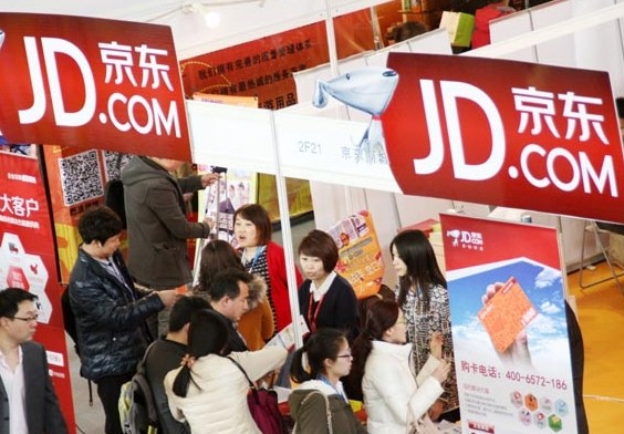 A JD.com Inc stand at a gifts and household items expo in Beijing. JD, one of the nation's leading e-commerce sites, has entered into partnerships with convenience stores in 15 cities in a move to develop its offline business. Provided to China Daily  