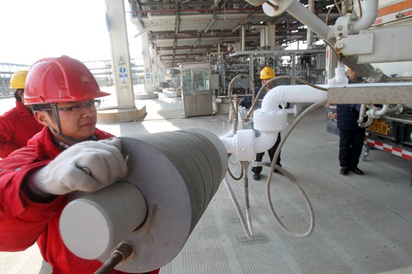 China National Petroleum Corp workers at a natural gas terminal in Nantong, Jiangsu province. Provided to China Daily
