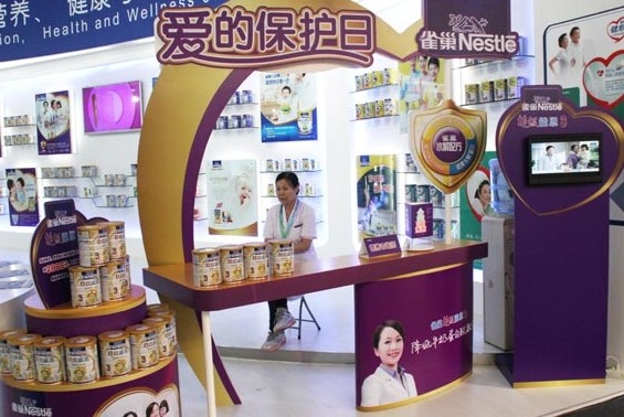 Nestle SA's booth at an internatoinal dairy products and imported food exhibition in Beijing. The company's sales growth in China slowed to 27.6 percent, much lower than the 91.4 percent in 2012. Wu Changqing / for China Daily