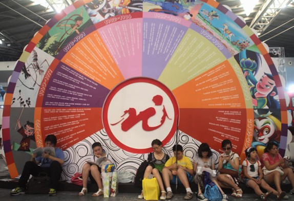 The logo and film titles of Shanghai Animation Film Studio, a company under the Shanghai Film Group, are shown at an international cartoon and game expo. The group released has its preliminary prospectus, indicating its aim to become the first listed State-owned film firm. Provided to China Daily  