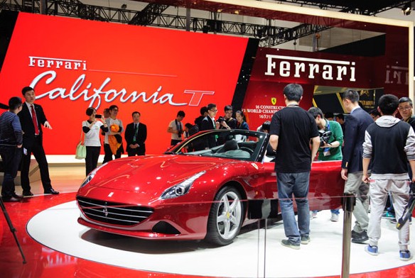 A Ferrari sports car is displayed at the Beijing Auto Show on Sunday. Provided to China Daily  