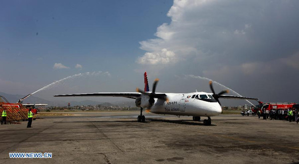 A China-made air carrier, a 58-seater Modern Ark 60 (MA60), lands on Tribhuvan International Airport in Kathmandu, Nepal, April 27, 2014. The long wait of Nepal government to receive the first China-made air carrier has been over Sunday afternoon with the landing of MA60 at Tribhuvan International Airport. (Xinhua/Sunil Sharma)