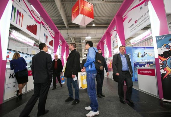 Chinese company booths attract visitors at an IT exhibition in Hanover, Germany last month. Xinhua