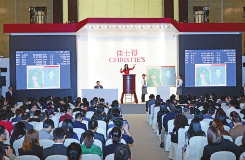 The auction scene in Christie's 2014 Spring Auction in Shanghai in April. Christie's' global sales reached $7.13 billion in 2013, up 14 percent from a year earlier. Provided to China Daily