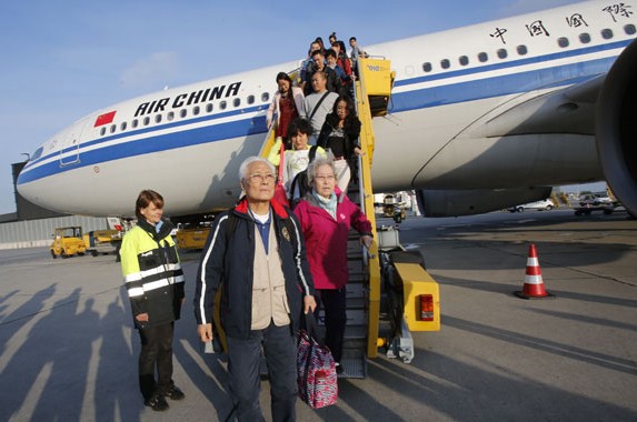 Passengers land in Vienna from a new Air China route on Monday. The Beijing-Vienna-Barcelona route is the latest industry move catering to increased cultural exchanges between China and Europe. An Airbus A330-300 will fly the route - Air China's 23rd to Europe, where it now has 19 city destinations - four times a week. Zhang Yuwei / Xinhua  