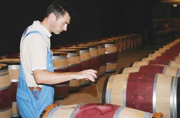 A worker at Chateau Leoville Poyferre, which has become the most popular brand of the Cuvelier family's wine business. Provided to China Daily  
