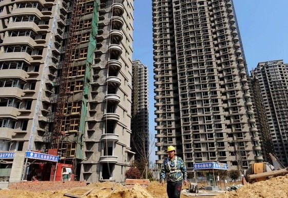 New towers go up in Qingdao, Shandong province. A new survey found that the residential vacancy rate in Chinese cities is higher than that in major US cities.[Photo/China Daily]  
