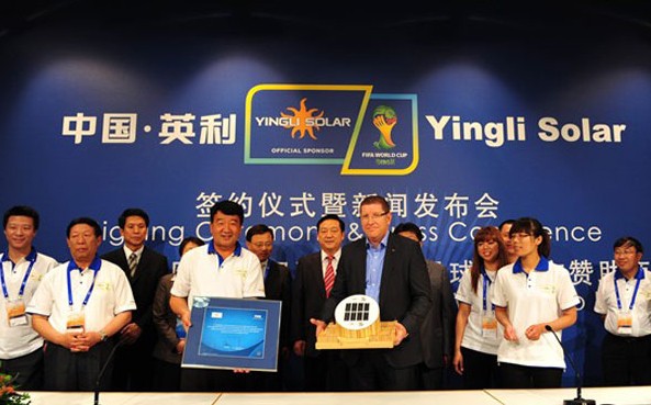 The signing ceremony for Yingli Solar to sponsor the 2014 World Cup in Brazil is shown taking place in June 2011.The company hopes to penetrate uncharted markets via the event. Provided for China Daily  