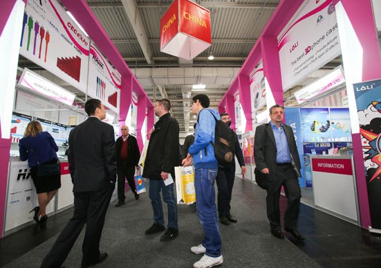 Foreign business representatives visit the stands of Chinese enterprises at an information technology exposition in Hanover, Germany. China is poised to become a net investment exporter in the coming five years, a United Nations official said. ZHANG FAN/XINHUA  