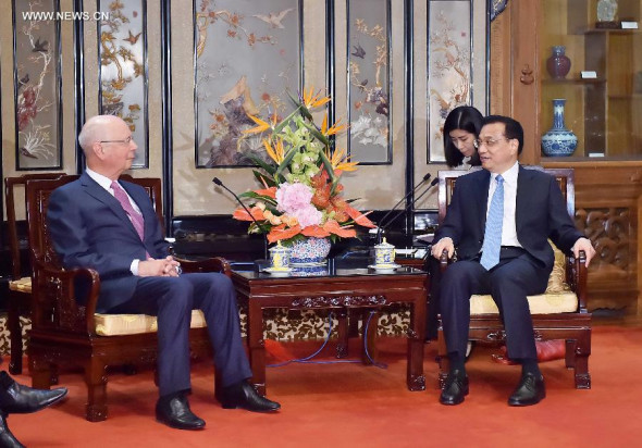 Chinese Premier Li Keqiang (R) meets with World Economic Forum (WEF) Founder and Executive Chairman Klaus Schwab in Beijing, China, May 28, 2014. (Xinhua/Li Tao)