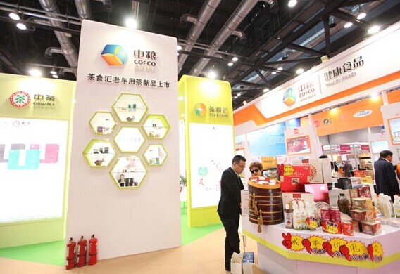 Cofco Group's display at a trade show in Beijing. Cofco will be a powerful global agricultural trader and able to procure directly around the world, Fitch Ratings Ltd said in an April 3 report. Provided to China Daily  