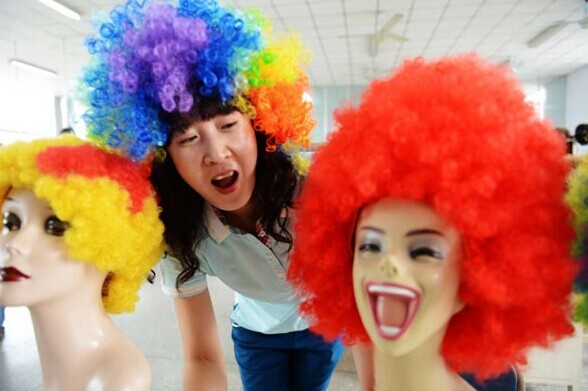 Orders for wigs from Jifa Group in Jimo city of East China's Shandong province soar as the FIFA World Cup draws near. Yu Fangping / For China Daily 