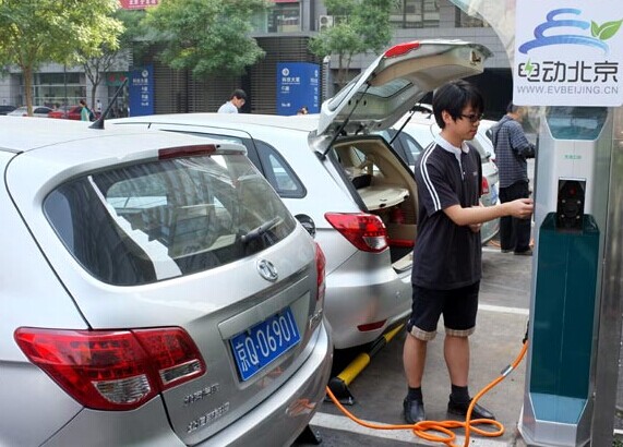 Tsinghua University Science Park in Beijing began offering 15 electric cars and 11 charging poles last year. Deng Jia / For China Daily  