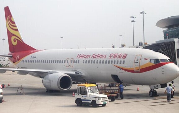 Airport workers load luggage into a Hainan Airlines aircraft at Changsha Huanghua International Airport. Provided to China Daily