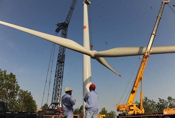 A wind farm under construction in Chuzhou, Anhui province. A big proportion of the projected investment of $5.7 trillion by 2035 will go to clean energy production, including wind and solar power. [Photo/China Daily]  