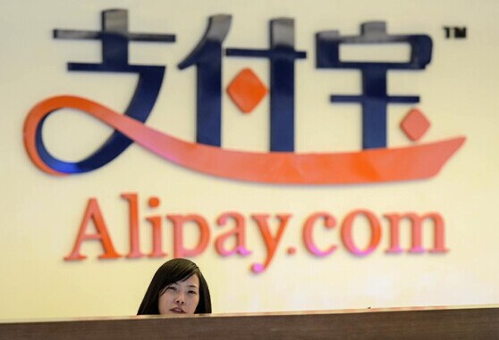 A receptionist works at Alipay's headquarters in Hangzhou, capital of East China's Zhejiang province, in this Jan 10, 2014 file photo. [Photo/Xinhua]  