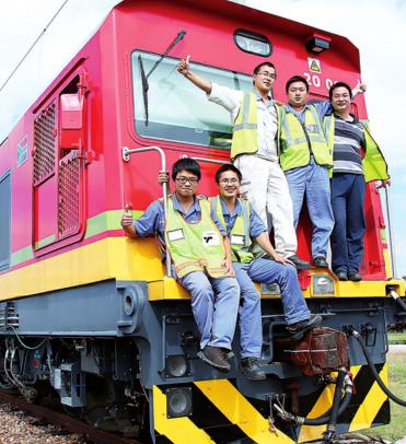 Employees of CSR E-Loco Supply (Pty) Ltd celebrate the arrival of locomotives in South Africa in November. CHINA DAILY
