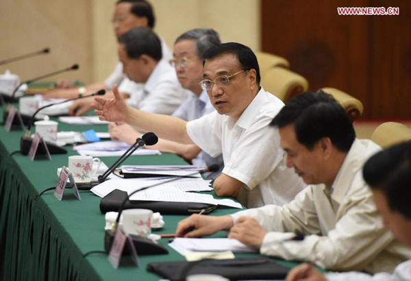 Chinese Premier Li Keqiang (3rd R) presides over a meeting with officials and business leaders from provinces including Hunan, Fujian, Shandong and Henan, in Changsha, capital of central China's Hunan Province, July 3, 2014. (Xinhua/Ma Zhancheng) 