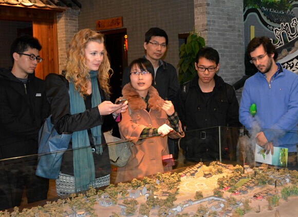 Members of the Foshan Bureau of Commerce visit the city's exhibition center to learn about local traditions. Provided to China Daily   