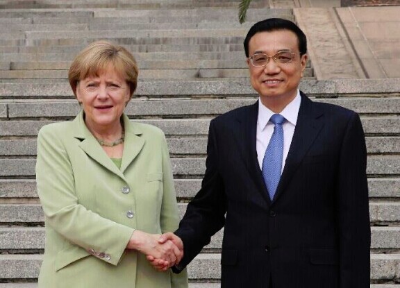 Chinese Premier Li Keqiang (R) shakes hands with German Chancellor Angela Merkel in Beijing, capital of China, July 7, 2014. Li and Merkel held talks later on Monday. (Xinhua/Liu Weibing)