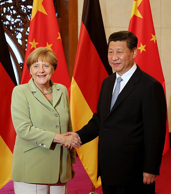 President Xi Jinping meets German Chancellor Angela Merkel at the Diaoyutai State Guesthouse in Beijing on Monday. [Xu Jingxing / China Daily]  