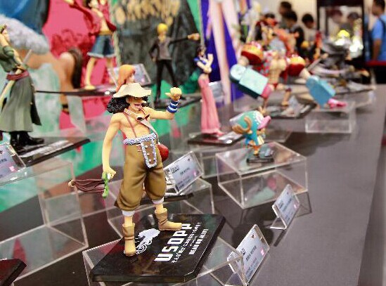 The cartoon character figurines is displayed during the 10th China International Cartoon & Game Expo (CCG Expo) in East China's Shanghai, July 10, 2014. [Photo/Xinhua]  