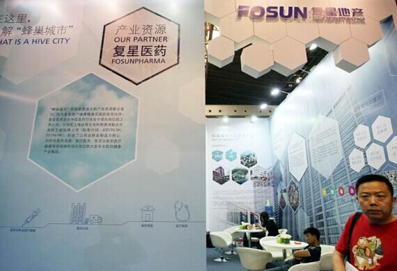 Fosun Group's booth at a recent international exhibition in Shanghai. Fosun plans to double its assets in the next five years and is on the lookout for healthcare, tourism and fashion acquisitions in the US and Europe. Provided to China Daily  