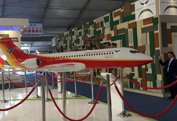 A model of ARJ21700, China's homegrown regional jetliner, on display at the Farnborough International Airshow, which opened on Monday. Total orders for the aircraft now stand at 258. WANG WEN / CHINA DAILY
