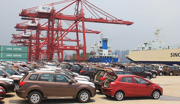 Cars await for export at a port in Haikou, Hainan province. [Shi Yan / For China Daily]  