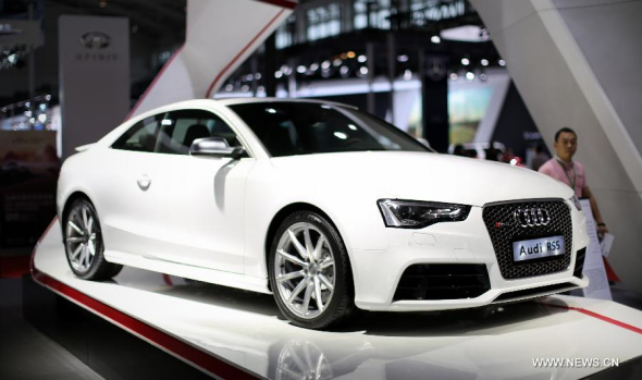 An Audi RS5 is displayed at the 2014 China (Shenyang) Auto Industry Expo in Shenyang, capital of northeast China's Liaoning Province, June 30, 2014. The 6-day auto show ended here on Monday. [Photo: Xinhua/Yao Jianfeng]