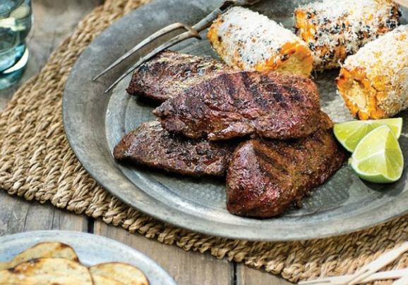 Barbequed kangaroo steaks with chips and sweet corn. 