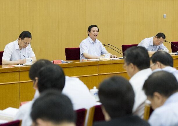 Liu Qibao (2nd L, back), a member of the Political Bureau of the Communist Party of China (CPC) Central Committee and the Secretariat of the CPC Central Committee, who is also head of the CPC Central Committee's Publicity Department, attends a symposium on credibility building in Beijing, China, July 30, 2014. (Xinhua/Huang Jingwen)