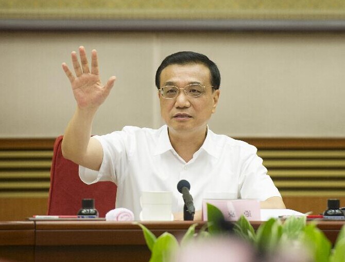 Chinese Premier Li Keqiang presides over a work conference on reinvigorating the outmoded industrial bases in China's northeast and other regions, in Beijing, capital of China, July 31, 2014. Chinese Vice Premier Zhang Gaoli, also a member of the Standing Committee of the Political Bureau of the CPC Central Committee, attended the conference. (Xinhua/Xie Huanchi)