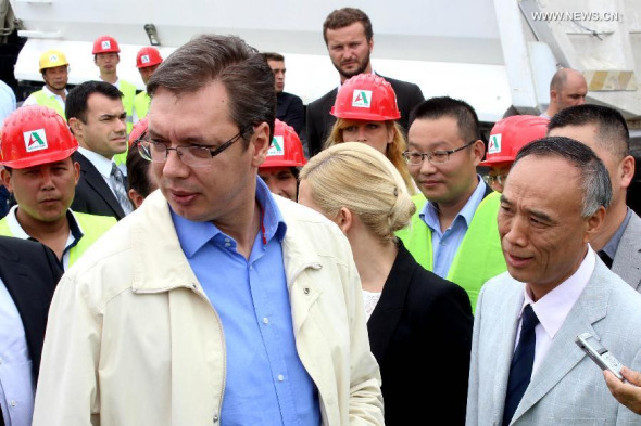Chinese Ambassador Li Manchang (R) and Serbian Prime Minister Aleksandar Vucic (L) attend the opening ceremony of the construction works at the European Corridor E763 through Serbia near the town of Ub, Serbia on Aug. 8, 2014. Chinese company Shandong High-speed started works at the European Corridor E763 through Serbia near the town of Ub on Friday, with the presence of Chinese ambassador Li Manchang. (Xinhua/Nemanja Cabric)