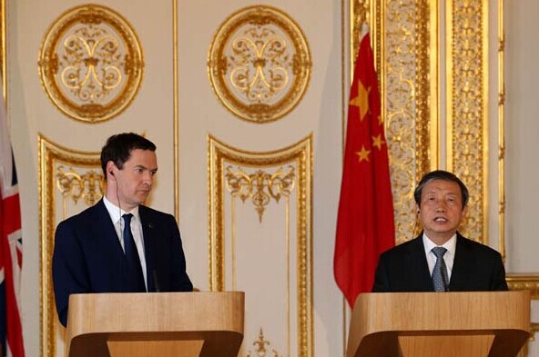 Vice-Premier Ma Kai and British Chancellor of the Exchequer George Osborne meet the press after the 6th China-UK Economic and Financial Dialogue in London. XINHUA