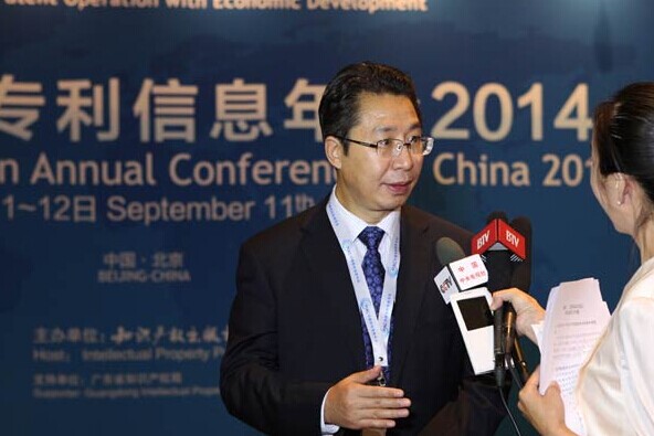 Shen Changyu, commissioner of the State Intellectual Property Office, speaks with the media at the Patent Information Annual Conference in Beijing last week. Jiang Wenjie / For China Daily  