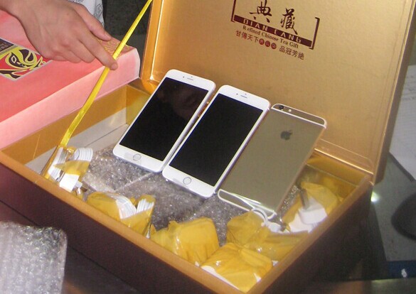 Smuggled iPhone 6 cellphones are found in a tea box by customs officers in Shenzhen, Guangdong province. CHINA DAILY   