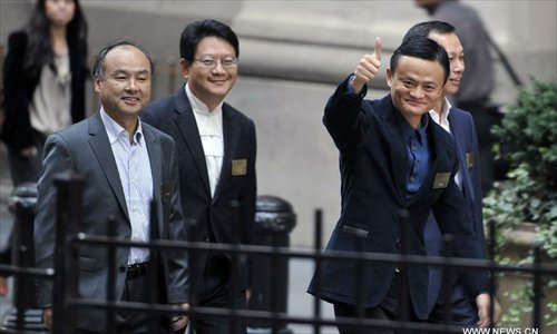 Jack Ma (R), board chairman of Alibaba Group, waves as he arrives at the New York Stock Exchange on Sept. 19, 2014. Chinese e-commerce giant Alibaba is set to begin trading on the New York Stock Exchange on Friday. Photo: Xinhua