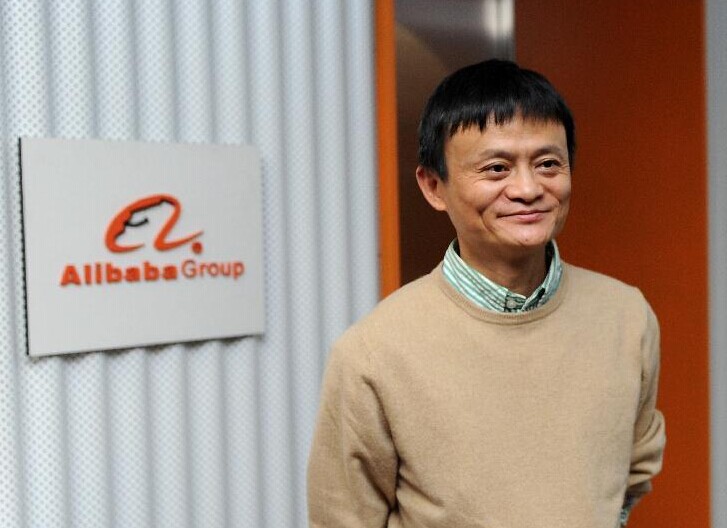 File photo shows founder and chairman of Alibaba Ma Yun poses for photos in front of Alibaba logo in Alibaba Group in Hangzhou, capital of east China's Zhejiang Province. Xinhua